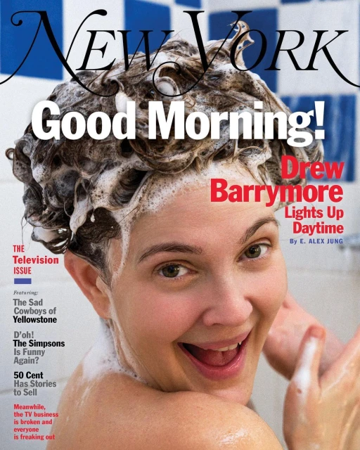 Magazine cover featuring a smiling woman with wet, soapy hair, posing in front of a blue and white tiled wall. 'New York' text visible.