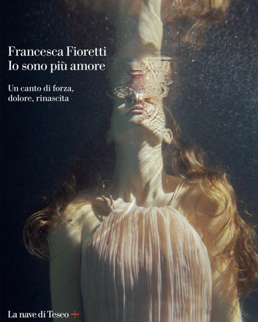 Underwater ethereal portrait of a woman with long hair, wearing a flowing dress, in a dark environment with light rays filtering through the water.