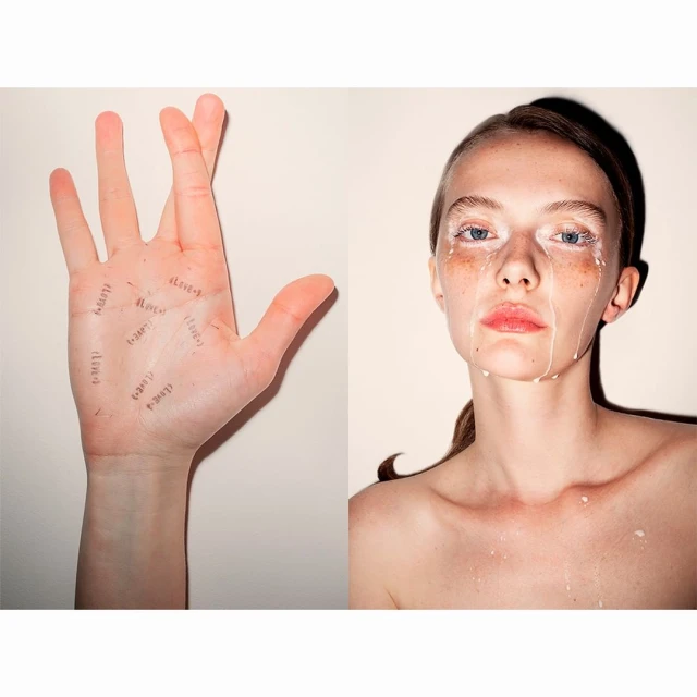 Artistic studio shot with a woman's face partially covered in white paint, contrasted with a hand inscribed with handwritten words.
