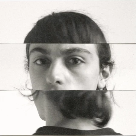 Abstract portrait of a person's face fragmented into horizontal bands on a white background, creating a surreal, distorted aesthetic.