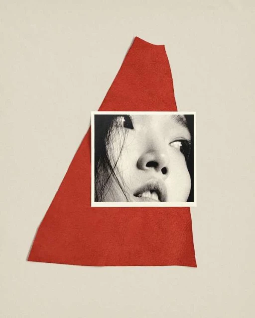 Black and white portrait photo of a person placed on a red leather triangle against an off-white backdrop.
