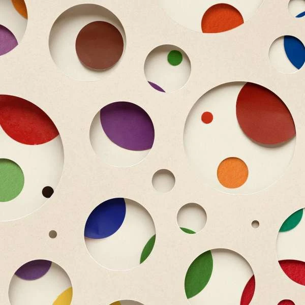 Abstract paper art with overlapping colorful circles in red, green, blue, purple, brown, and orange, casting shadows on white background.