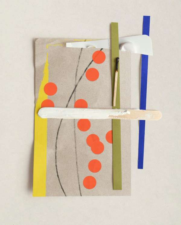 Abstract art collage featuring paper scraps, matchstick, popsicle stick, and orange dots, set against a neutral background.