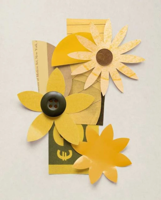 Paper collage art featuring yellow flower cutouts, button, and coin on textured paper background. Decorative floral still life art.