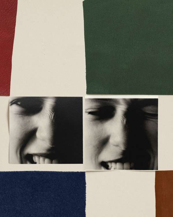 Black and white photograph collage with two faces of the same person expressing joy alongside red, green, white, and blue blocks.