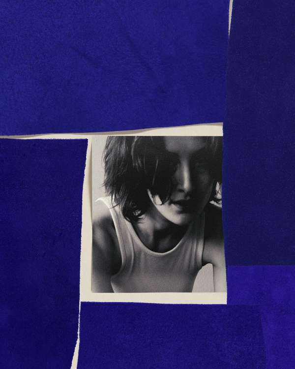 Monochrome portrait of a woman in a white tank top, framed by a geometric collage of textured blue paper pieces.