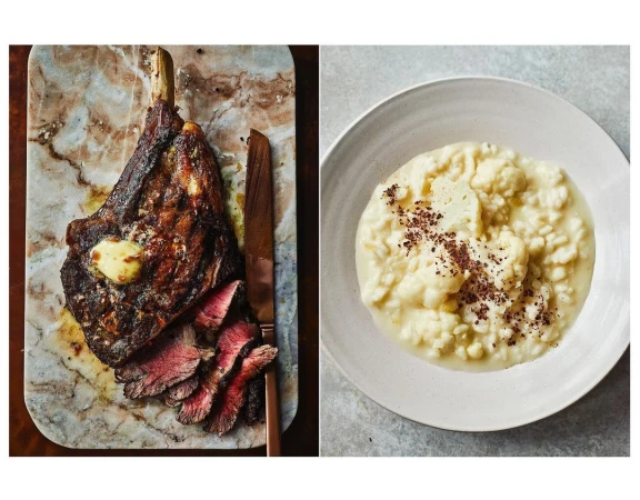 Overhead shot of a Tomahawk steak cooked medium-rare, served with butter on a marble cutting board, paired with cauliflower puree.