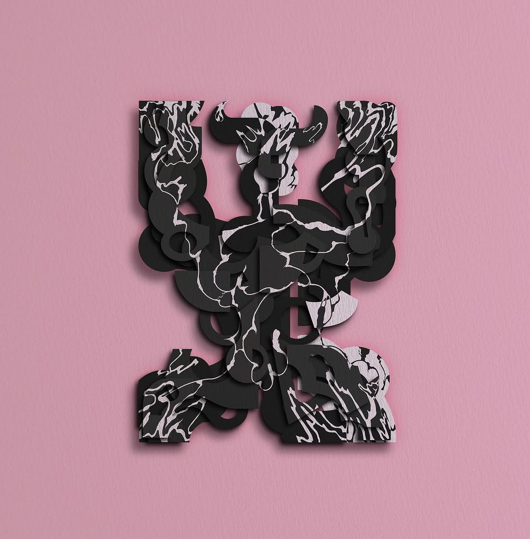 Abstract black and white marbled paper art composition on a pink background, textured surface, and studio lighting.