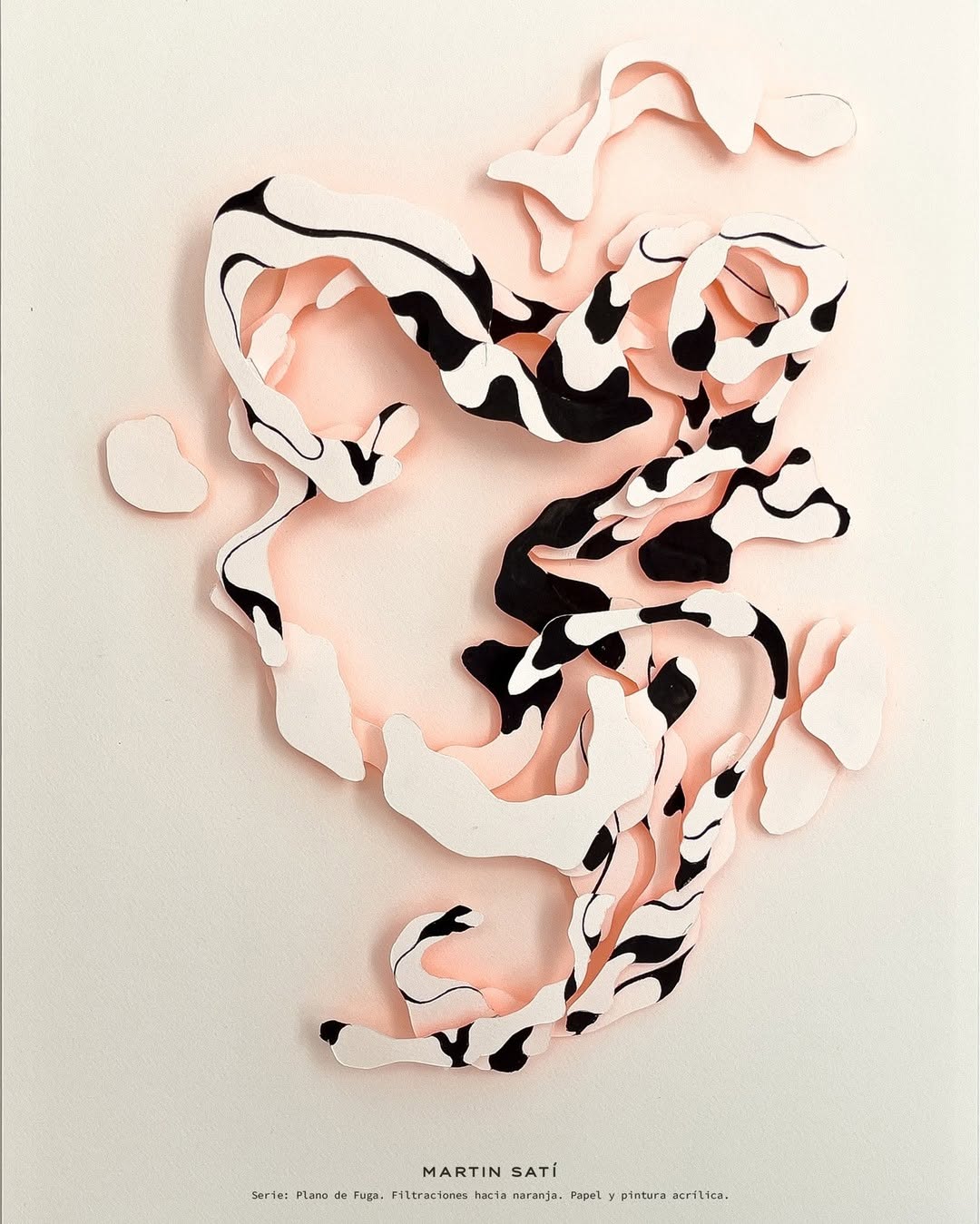 Abstract paper art with swirling black and white patterns on a pink background creating a modern, artistic, and textured visual.