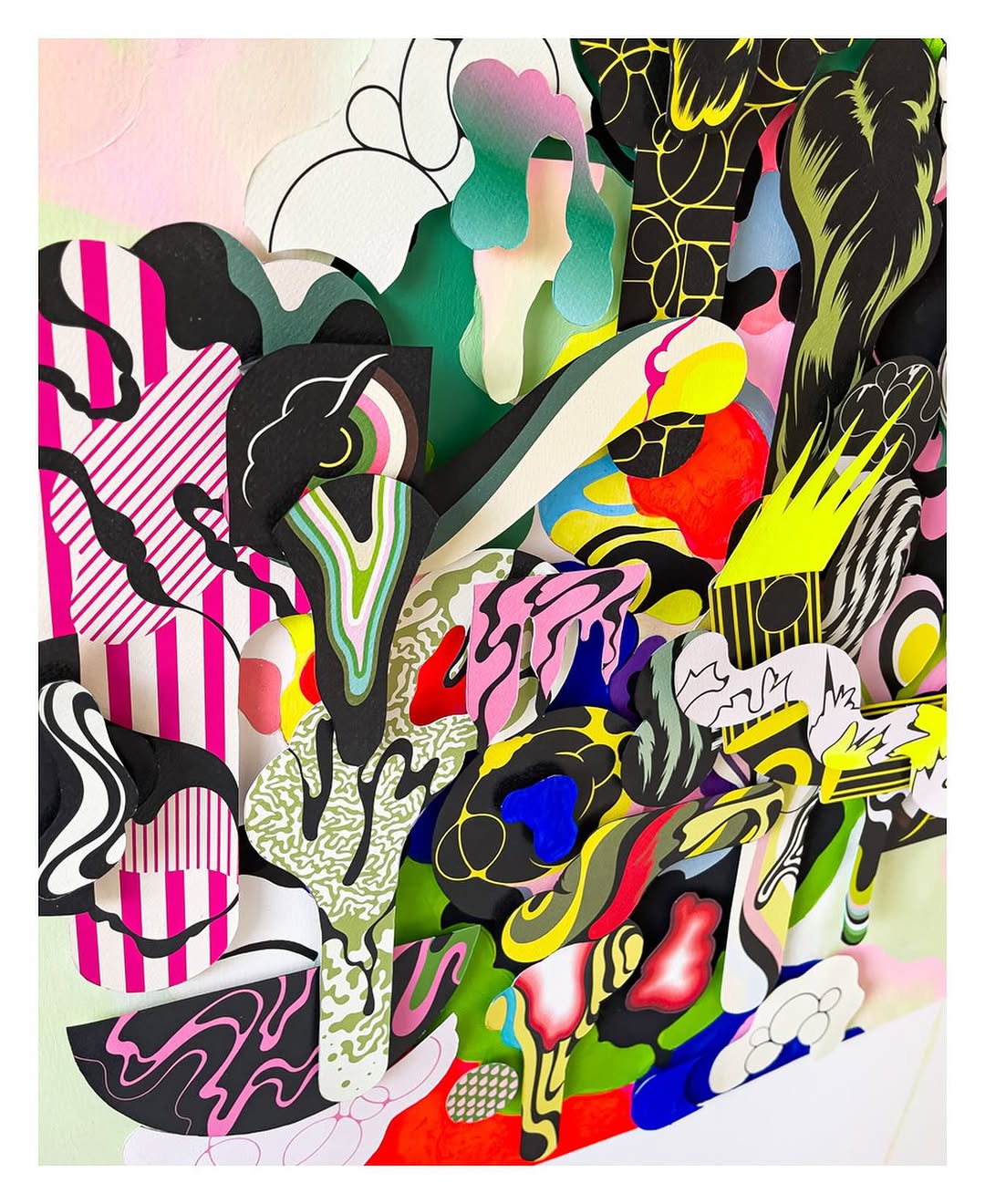 Abstract collage with vibrant colors, layered paper, and geometric patterns creating a dynamic and playful visual composition.