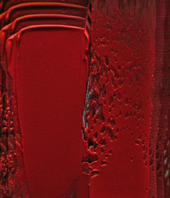 Abstract painting featuring textured strokes of vibrant red paint, creating a visually striking and dynamic composition.