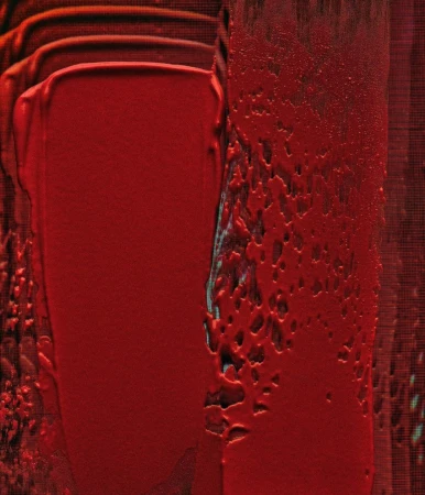 Abstract painting featuring textured strokes of vibrant red paint, creating a visually striking and dynamic composition.