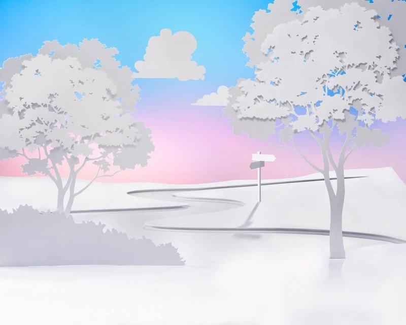 Paper art landscape featuring a winding road, trees, a signpost, and white clouds against a gradient blue and pink sky background.