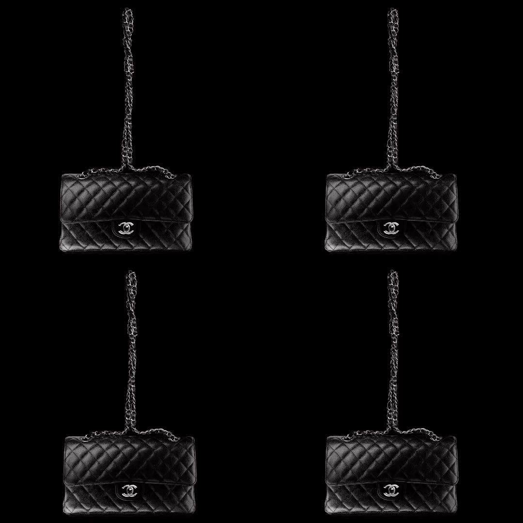 Four black quilted Chanel flap bags with silver chain straps arranged symmetrically against a solid black backdrop.