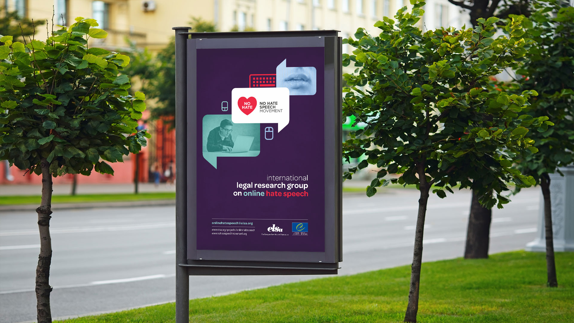 Outdoor billboard advertising an international legal research group on online hate speech, featuring graphic elements and organizational logos.