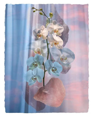 Elegant orchid blossoms in white and blue hues are displayed alongside rose quartz stones against a blurred pastel sunset backdrop.