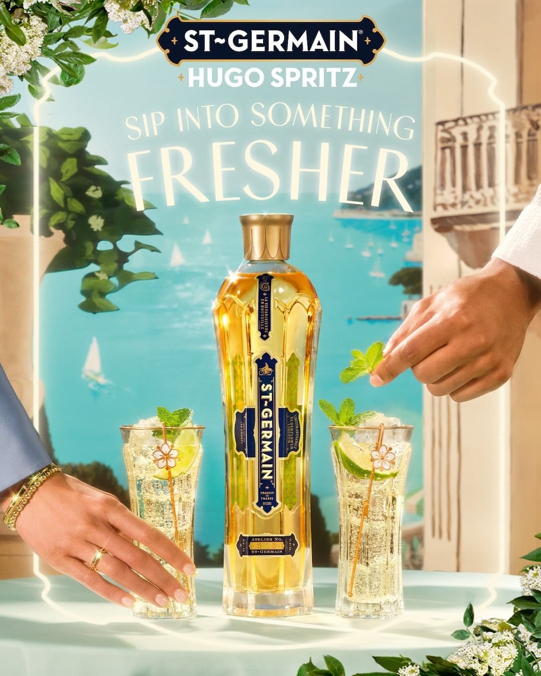 St-Germain Hugo Spritz ad featuring a bottle and cocktails on a light blue table with a balcony and ocean view in the background.