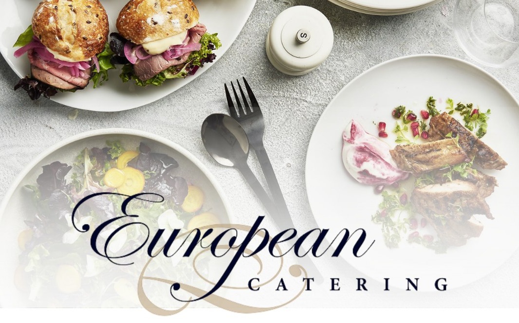 Top-down view of gourmet dishes including mini roast beef sliders, salad, and sliced meat with pomegranate on white plates.