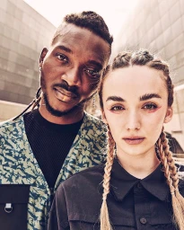 Portrait of a Black man and a woman with braided hair by photographer Matt Hawthorne