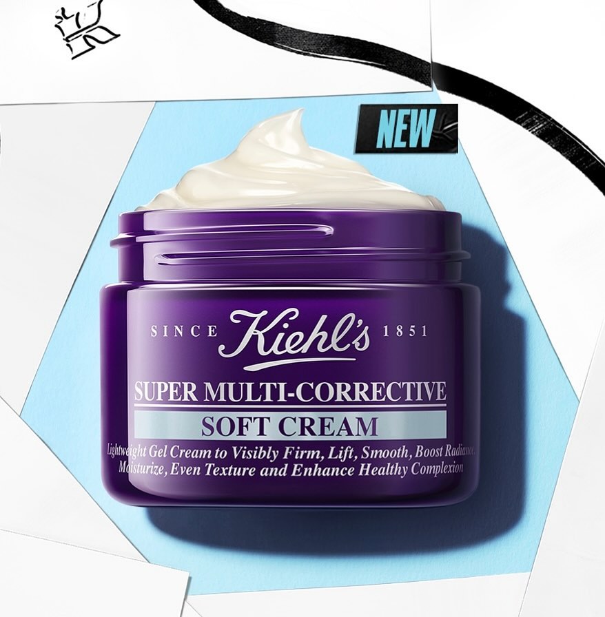 Kiehl's Super Multi-Corrective Soft Cream in purple container with white cream on a blue, white, and black background.
