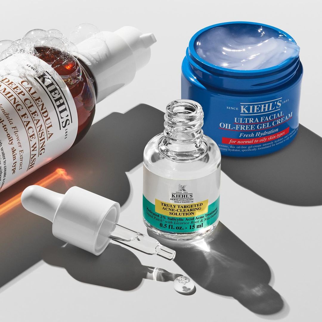 Kiehl's skincare products including Calendula Deep Cleansing Foaming Face Wash, Ultra Facial Oil-Free Gel Cream, and acne clearing solution.