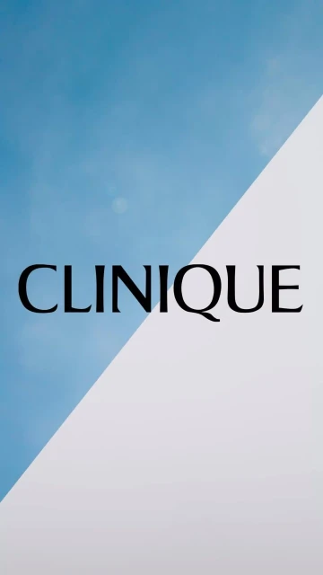 Clinique brand advertisement featuring a blue and white backdrop split diagonally, showcasing the brand name in black lettering.