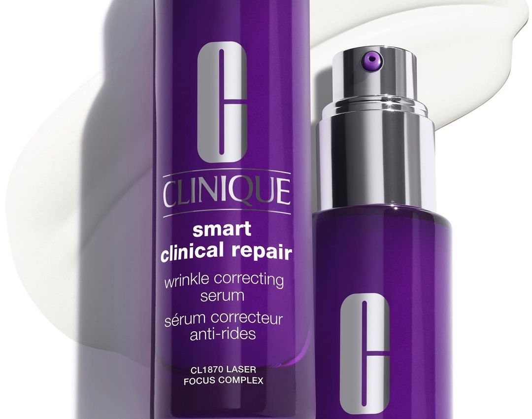 Clinique Smart Clinical Repair wrinkle correcting serum bottles, featuring a purple container with silver text on a white background.