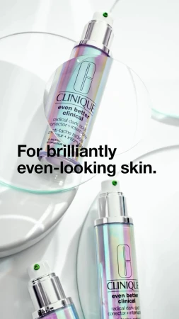 Clinique Even Better Clinical Radical Dark Spot Corrector displayed with transparent geometric shapes on a white surface for beauty advertising.