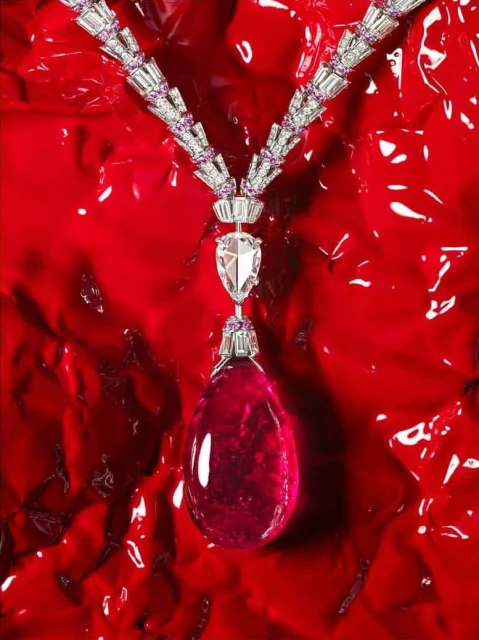 Elegant necklace with gemstones and diamonds on a red background, studio lighting, jewelry photography, luxury style, beauty shot