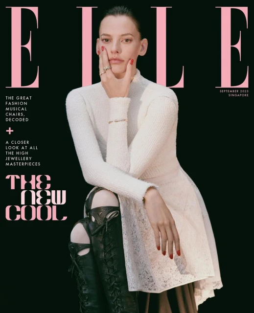Elle magazine cover featuring a model in a white dress and black boots against a black background, September 2023 Singapore edition.