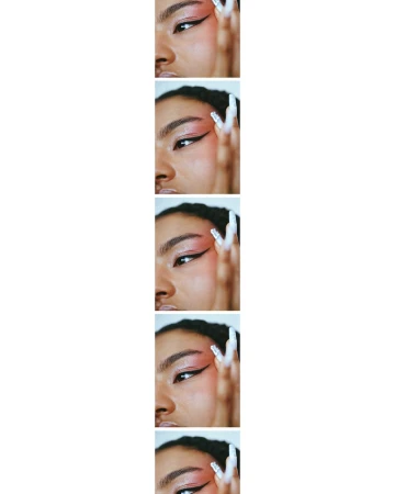 Eye makeup close-up: An adult female face fragment in a vertical sequence showcases pink eyeshadow, winged black eyeliner, and long white nails.