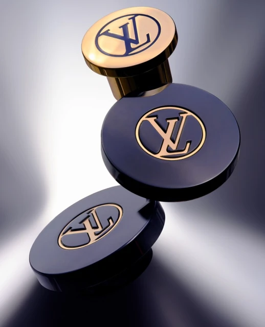 Luxury product shot: two-tone perfume bottles with the Louis Vuitton logo. Gold and navy blue create a sleek, high-end aesthetic.
