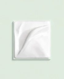 Close-up product photography of smooth white cream sample on light green square tile by Matthieu Gadoin