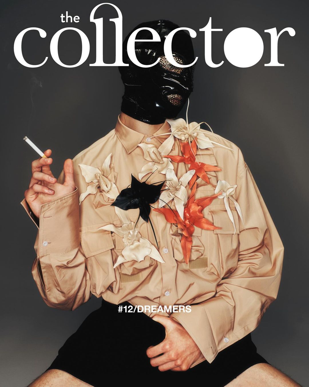 Magazine cover featuring a person in a beige shirt and black balaclava, adorned with floral embellishments, holding a cigarette.