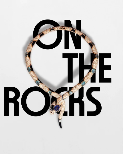 Serpentine necklace coiled on a white background with 'ON THE ROCKS' in bold black text, ideal for beauty or luxury brand campaigns.