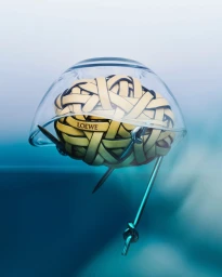 Woven leather brain sculpture encased in a clear glass dome with metal pins by Mattia Iotti