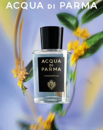 Acqua di Parma Osmathus perfume bottle with floral accents on a soft blue gradient backdrop, highlighting its elegant design.