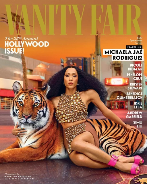 Magazine cover featuring Michaela Jaé Rodriguez with a tiger in an urban setting at dusk, promoting Vanity Fair's Hollywood Issue.