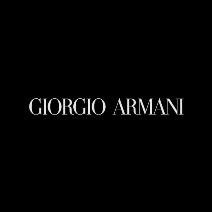 Elegant Giorgio Armani brand logo on a black background, perfect for luxury fashion and brand recognition in digital marketing.