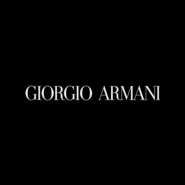 Elegant Giorgio Armani brand logo on a black background, perfect for luxury fashion and brand recognition in digital marketing.