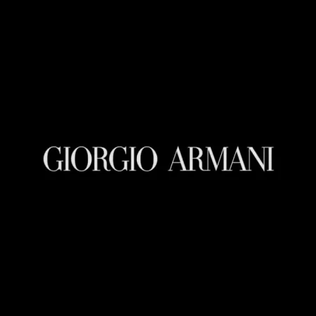 Elegant Giorgio Armani brand logo on a black background, perfect for luxury fashion and brand recognition in digital marketing.