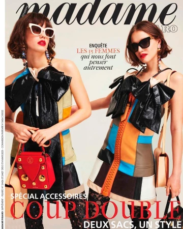 Magazine cover featuring two adult females with sunglasses, colorful dresses, bags, and the title 'madame FIGARO'. Fashion editorial.