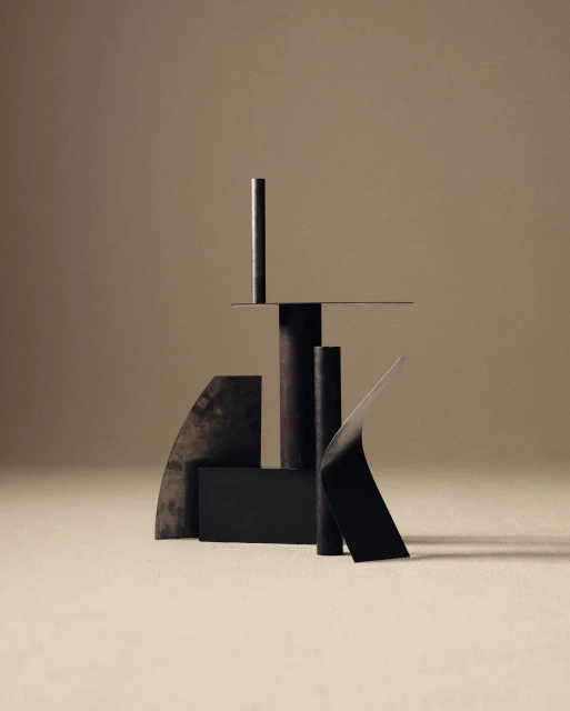 Abstract geometric shapes and cylinders in neutral tones, creating a minimalist composition with subtle shadows and textures.