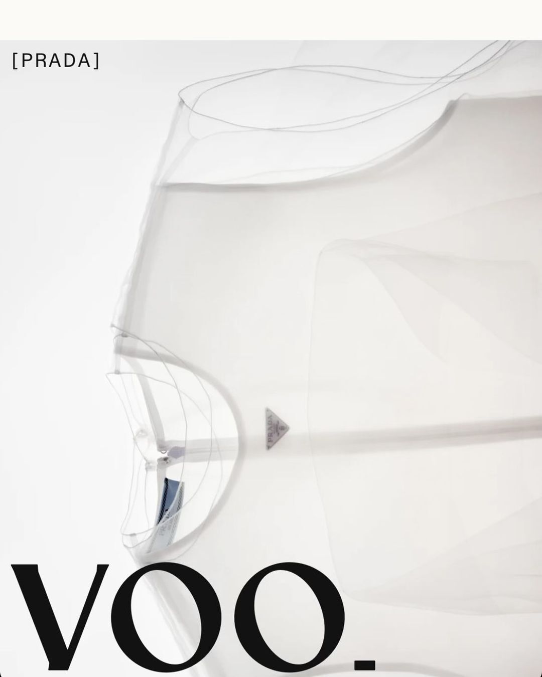 Abstract fashion image: a semi-transparent garment with subtle lines, juxtaposed against a stark white background with bold black typography.