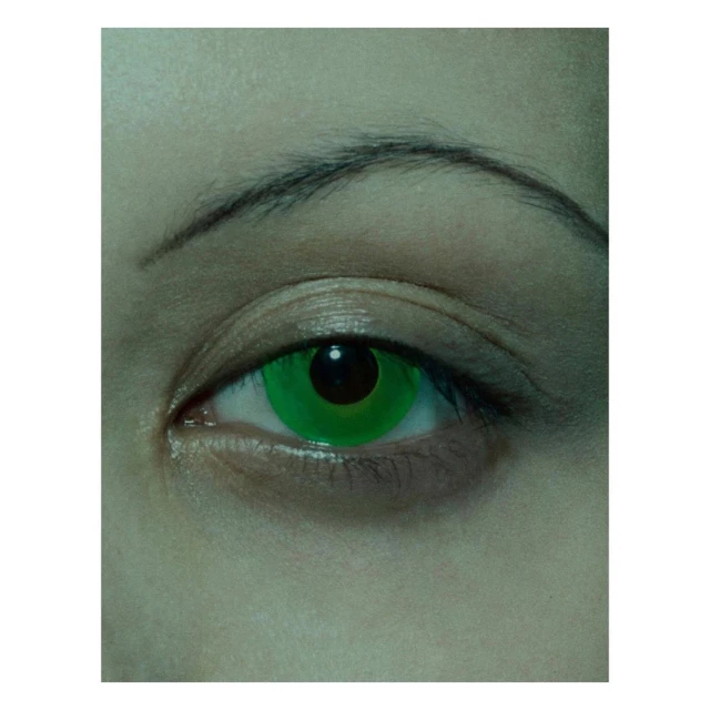 Close-up of an adult female's eye with green special-effect contact lens. Visible skin tone is fair, and the eyebrow is dark.