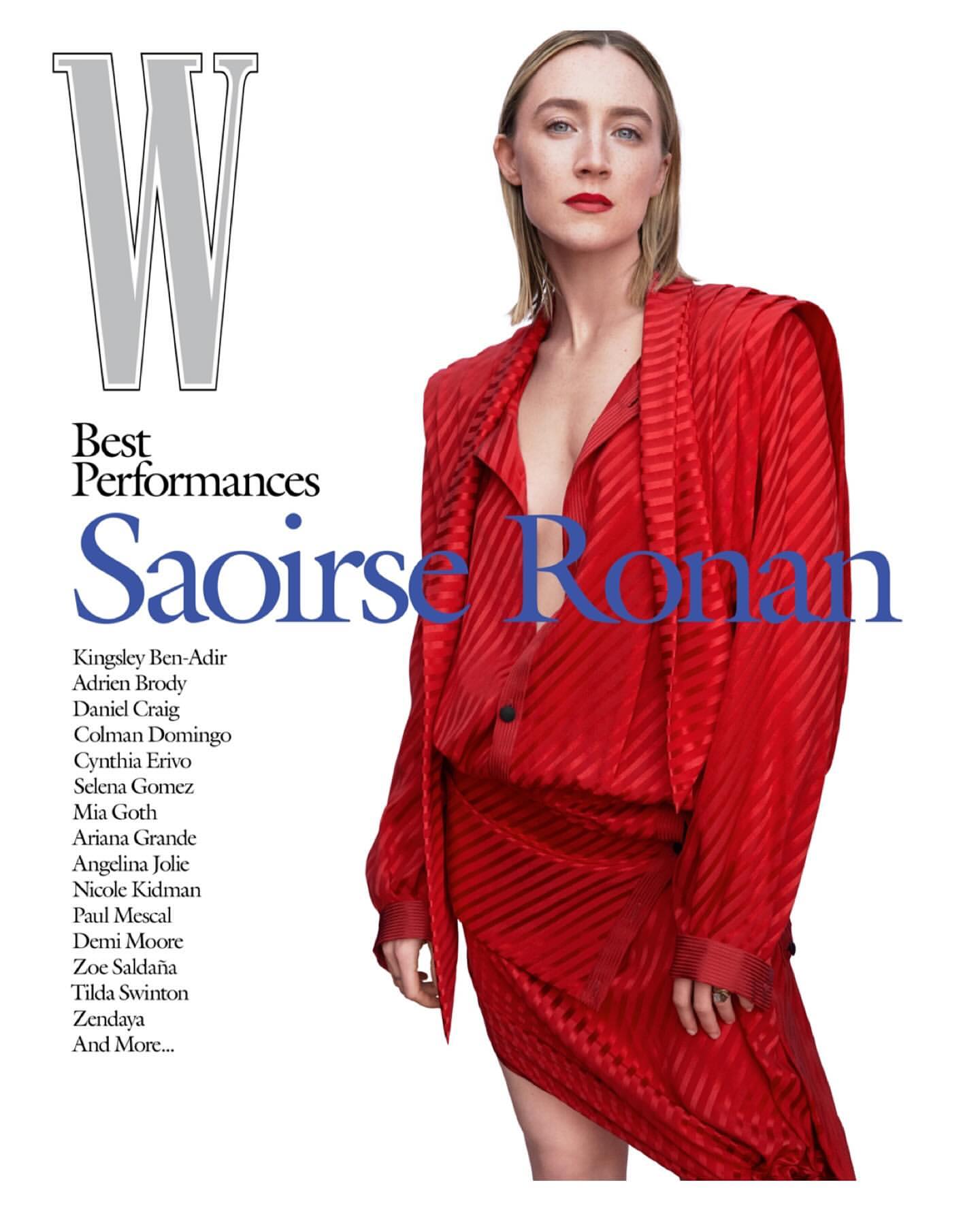 Saoirse Ronan in a red jacket and skirt. Portrait for W Magazine Best Performances, posed in front of a white backdrop with magazine text.