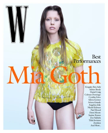 Mia Goth magazine cover: Woman in yellow patterned top and black bottoms on white background for W Magazine, Best Performances.