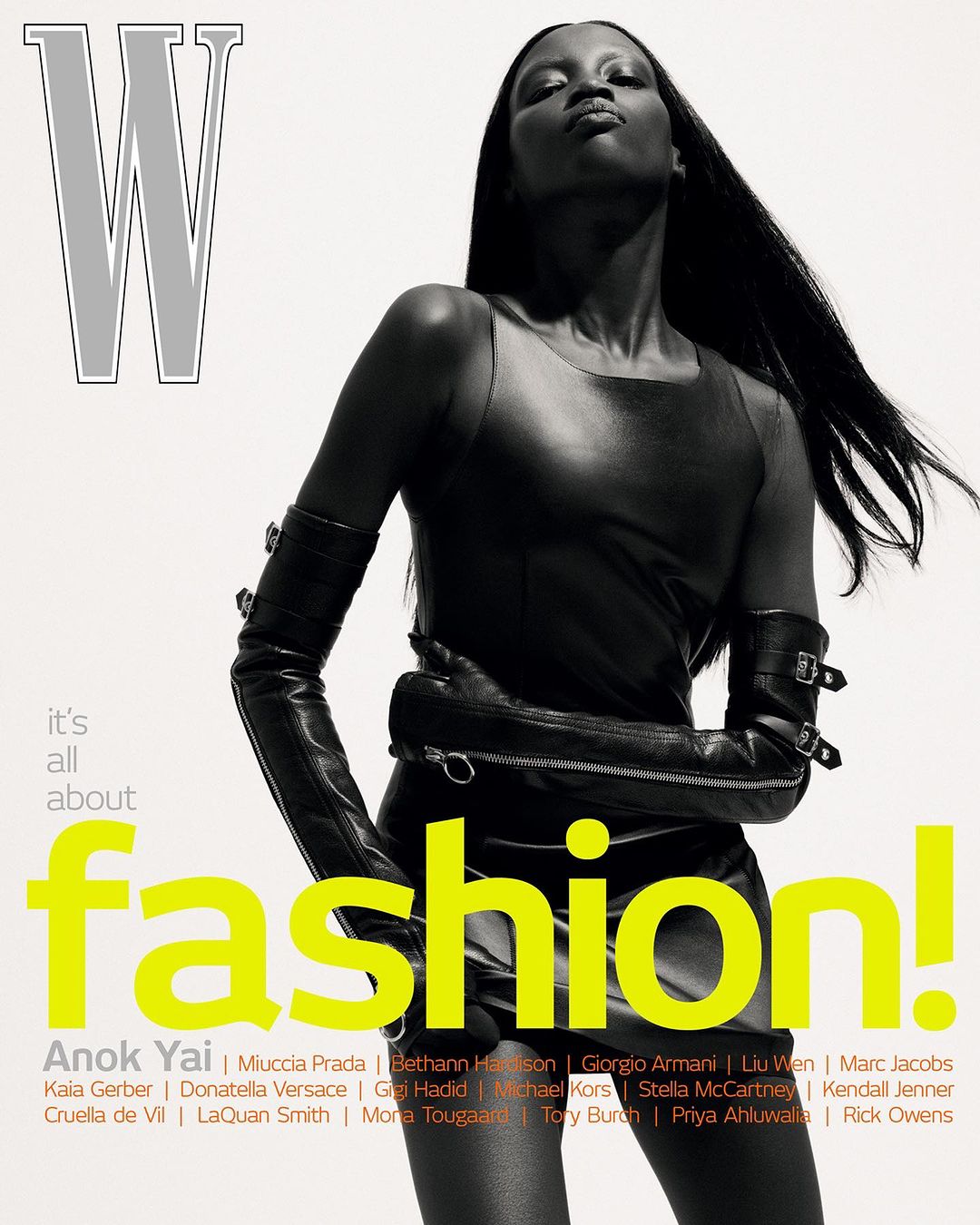 Magazine cover featuring a fashionable woman in a black dress and long gloves against a white backdrop with bold typography.