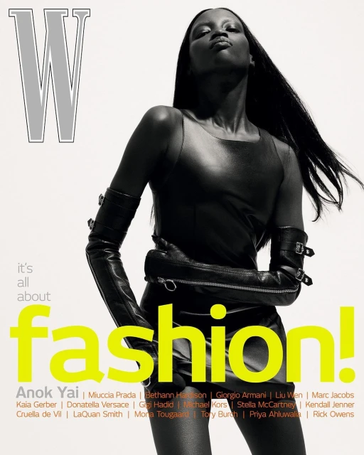 Magazine cover featuring a fashionable woman in a black dress and long gloves against a white backdrop with bold typography.