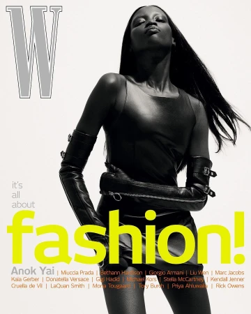 Magazine cover featuring a fashionable woman in a black dress and long gloves against a white backdrop with bold typography.